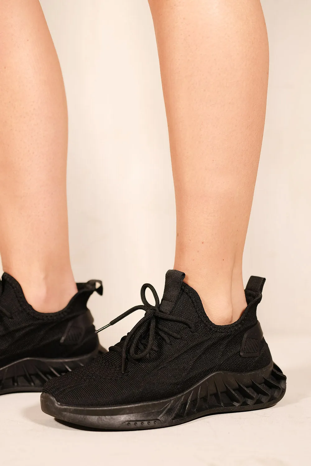 NYMRA PLATFORM RUBBER SOLE KNITTED TRAINERS IN BLACK